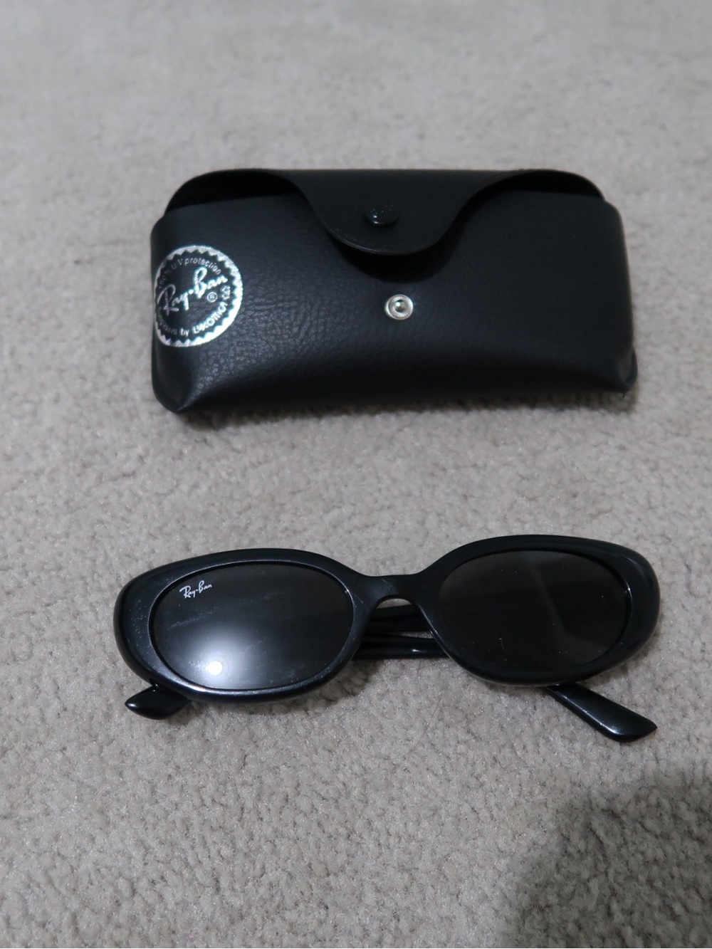 Ray-Ban Women’s Black Oval Sunglasses with Black Lenses
